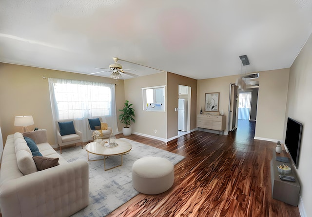 living room with ceiling fan and dark hardwood / wood-style floors