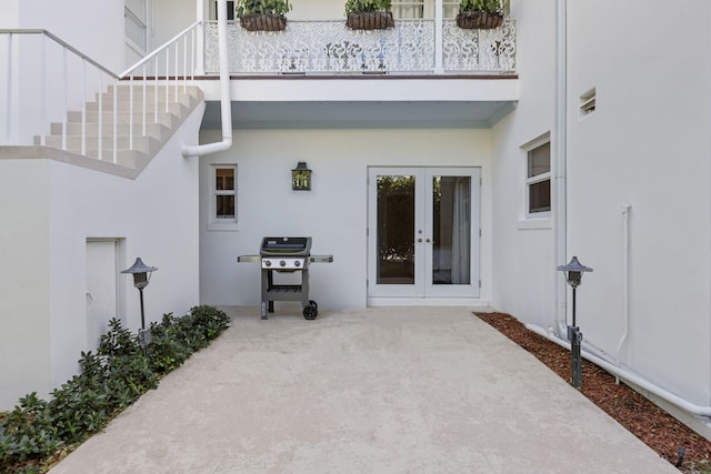 doorway to property featuring a patio area and french doors