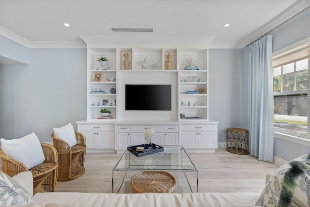 living room featuring light hardwood / wood-style flooring and ornamental molding