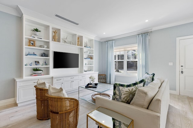 living room featuring light hardwood / wood-style flooring and crown molding