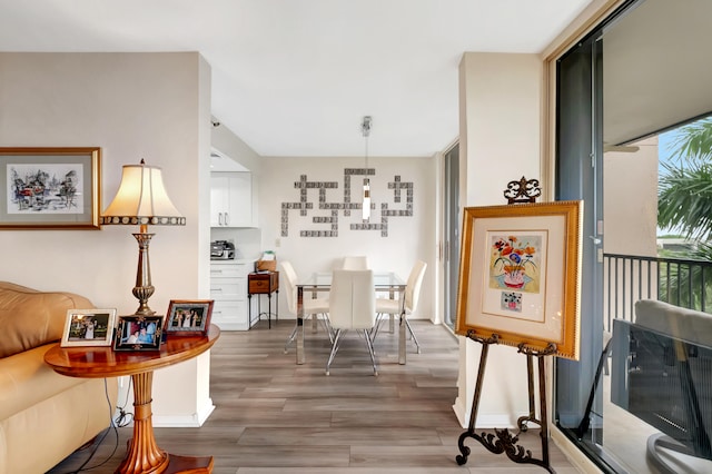 interior space with hardwood / wood-style flooring and a wall of windows