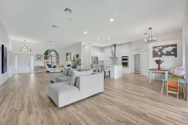 living room with light hardwood / wood-style flooring