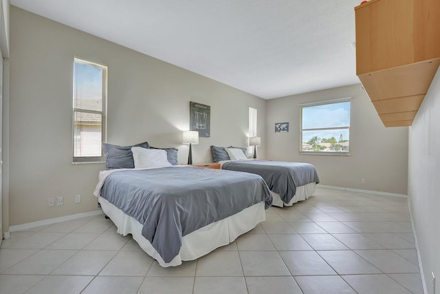 bedroom with light tile patterned flooring