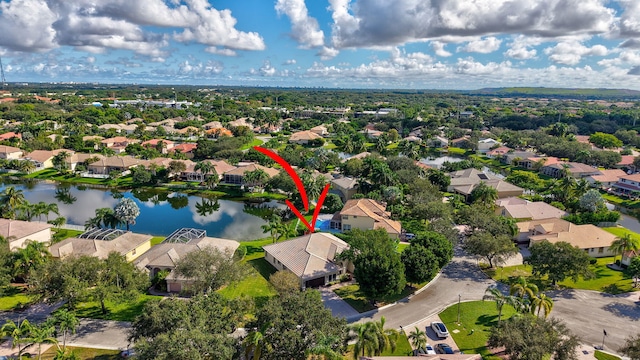 birds eye view of property featuring a water view