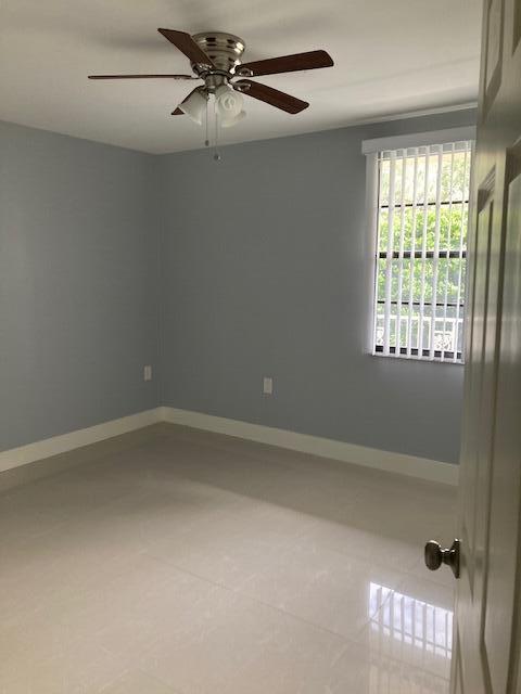 spare room featuring ceiling fan