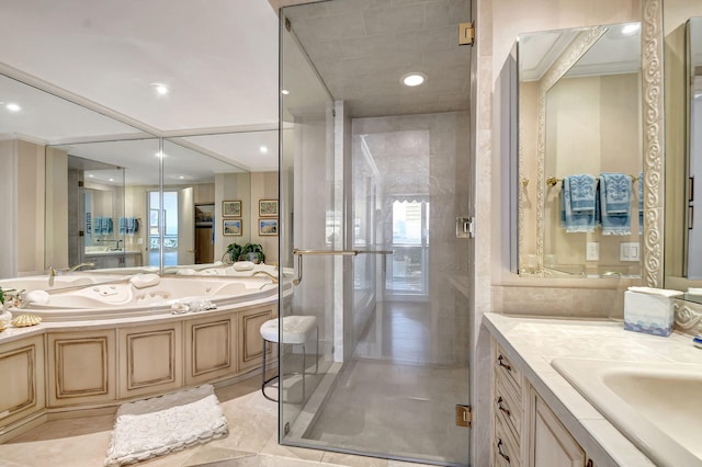 bathroom with tile patterned floors, vanity, a healthy amount of sunlight, and independent shower and bath