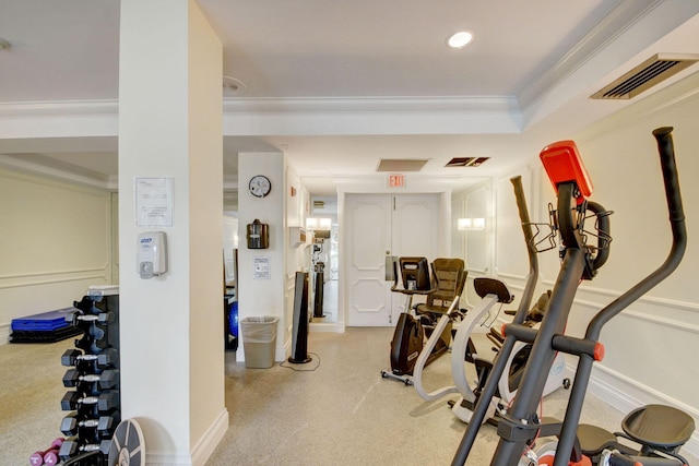 workout room featuring ornamental molding