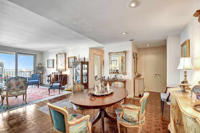 dining area with crown molding