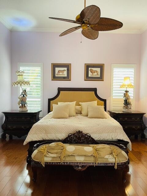 kitchen featuring sink, hanging light fixtures, light stone countertops, ornamental molding, and cream cabinetry