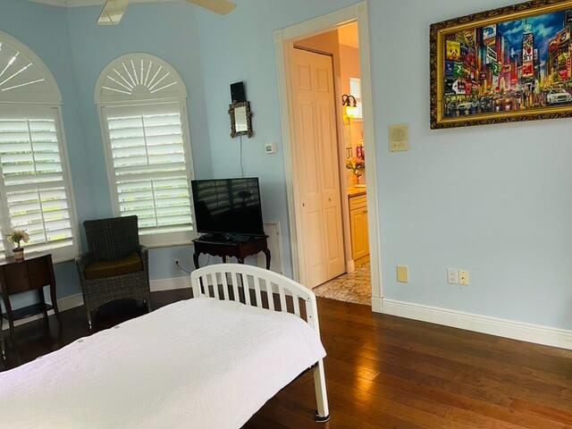 kitchen featuring decorative backsplash, light stone counters, stainless steel appliances, and cream cabinets