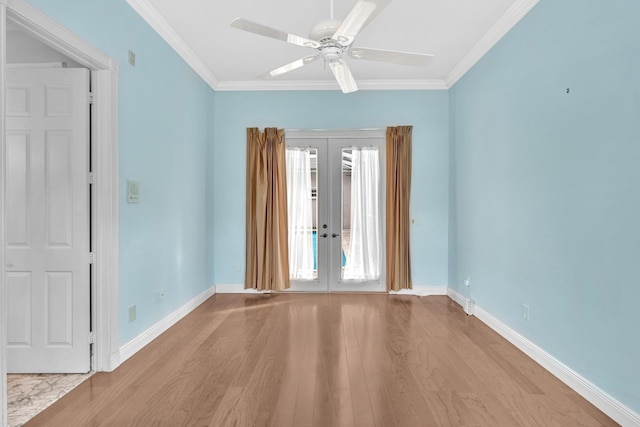 empty room featuring ceiling fan, light hardwood / wood-style floors, crown molding, and french doors