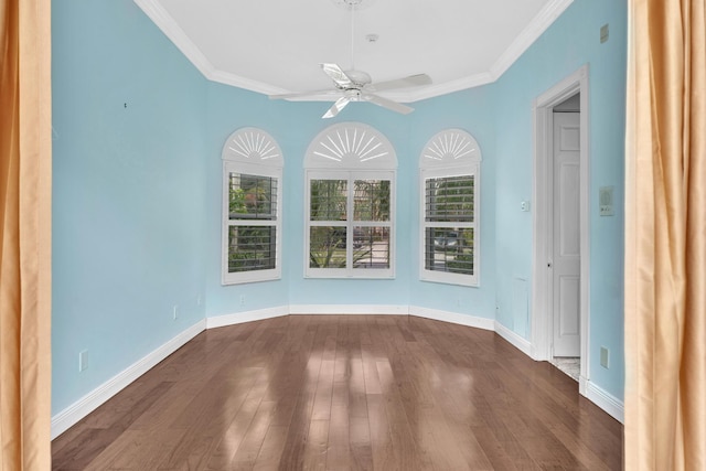 unfurnished room with ceiling fan, dark hardwood / wood-style flooring, and ornamental molding