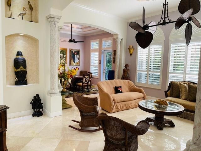 kitchen with ceiling fan, sink, cream cabinetry, appliances with stainless steel finishes, and ornamental molding