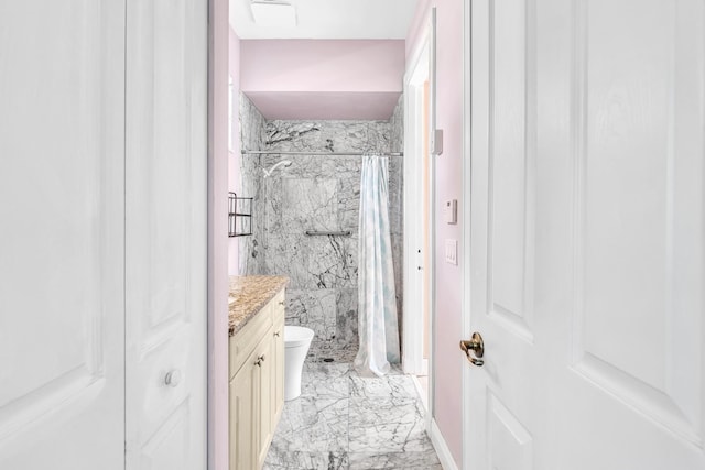 bathroom featuring vanity, toilet, and walk in shower