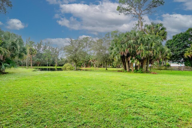 1630 F Rd, Loxahatchee Groves, FL 33470 - view of yard featuring view of wooded area