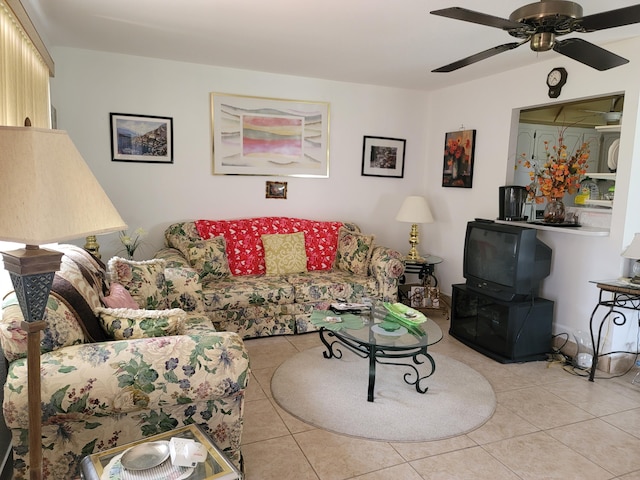 living room with ceiling fan and light tile patterned floors