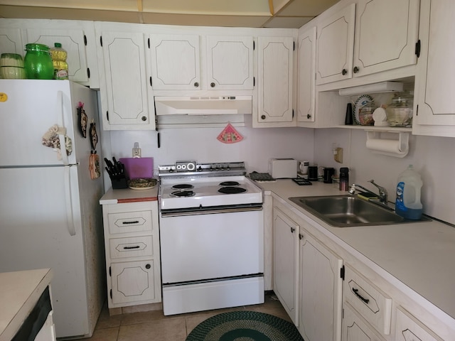 kitchen with white cabinets, white appliances, sink, and light tile patterned floors