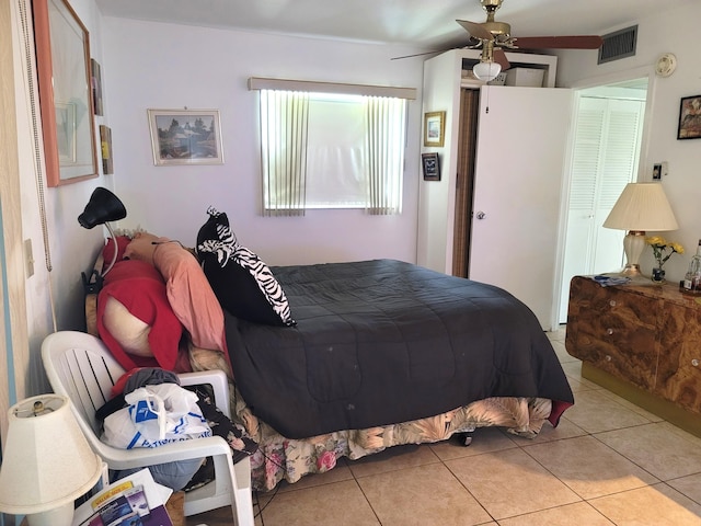 bedroom featuring ceiling fan and light tile patterned floors