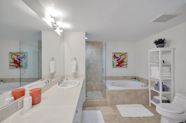 full bathroom featuring tile patterned flooring, vanity, shower with separate bathtub, and toilet