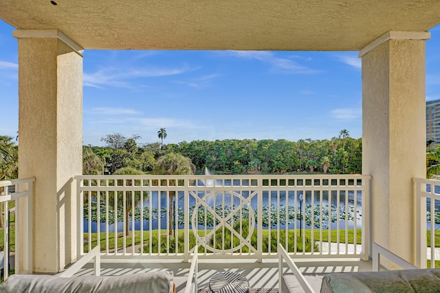 balcony featuring a water view