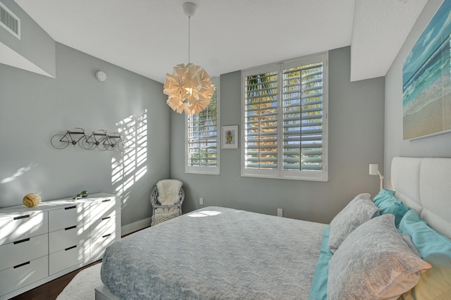 bedroom featuring dark hardwood / wood-style floors