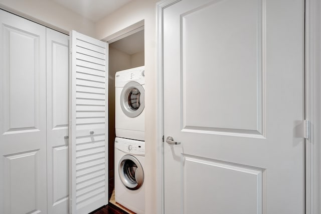 laundry area featuring stacked washer and clothes dryer