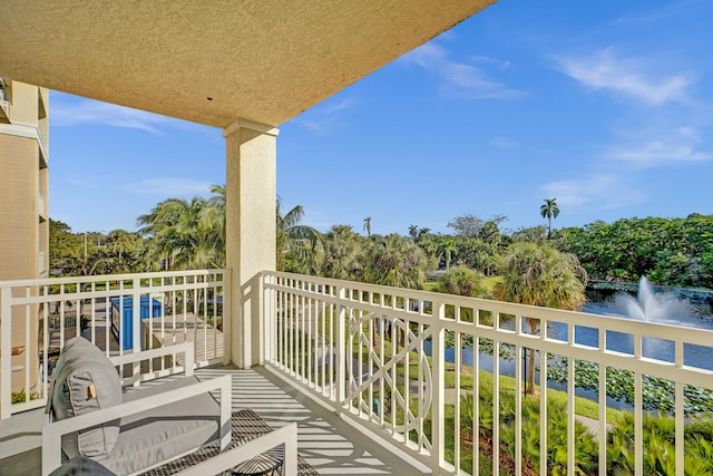 balcony featuring a water view