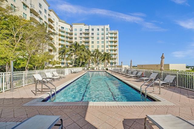 view of swimming pool with a patio area