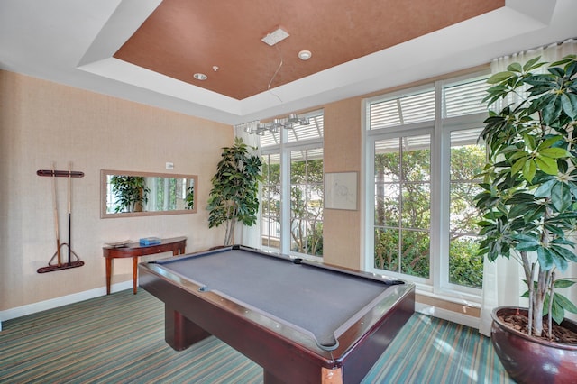 recreation room with a raised ceiling, dark carpet, a notable chandelier, and pool table