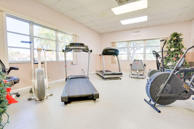 workout room featuring a paneled ceiling