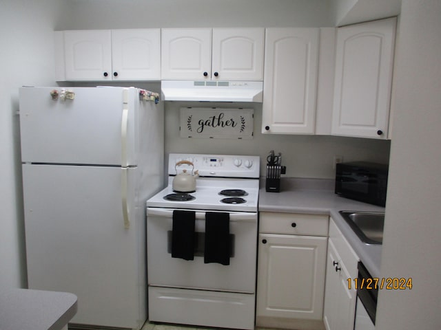 kitchen featuring white cabinetry, sink, and white appliances