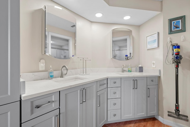 bathroom featuring hardwood / wood-style floors and vanity