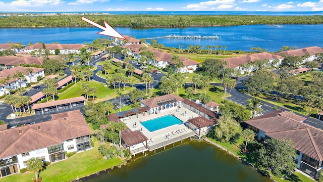 birds eye view of property featuring a water view