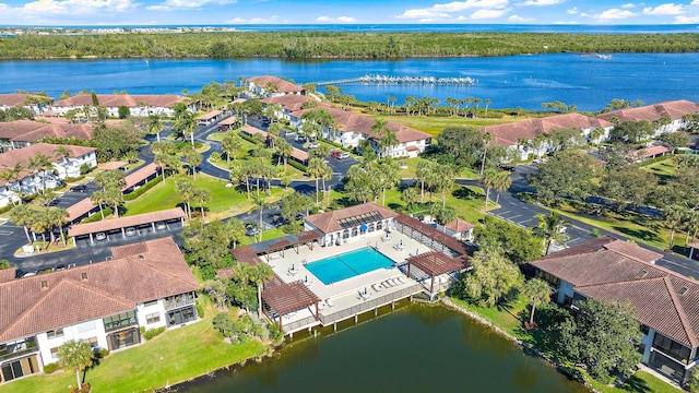 birds eye view of property with a water view