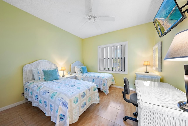 bedroom featuring ceiling fan and tile patterned flooring