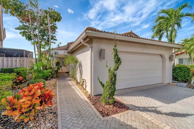 view of side of home with a garage