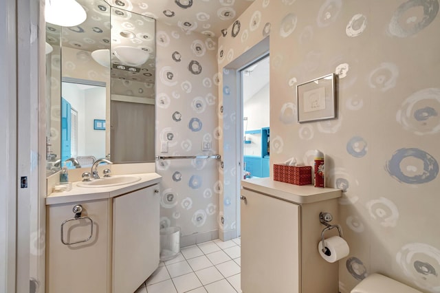 bathroom with tile patterned flooring and vanity