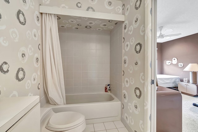 full bathroom with shower / bath combo, toilet, tile patterned floors, vanity, and ceiling fan