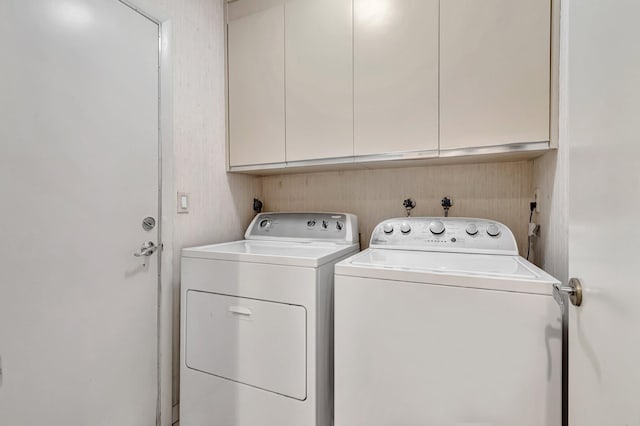 laundry area with cabinets and washer and dryer