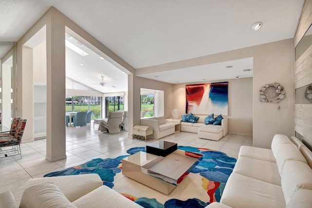 living room featuring ceiling fan and light tile patterned floors