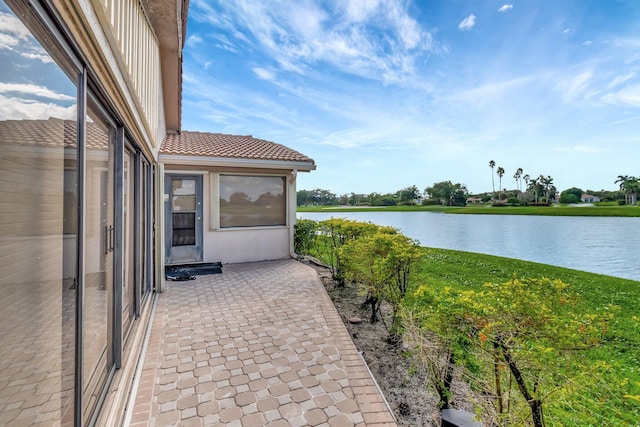 view of patio with a water view