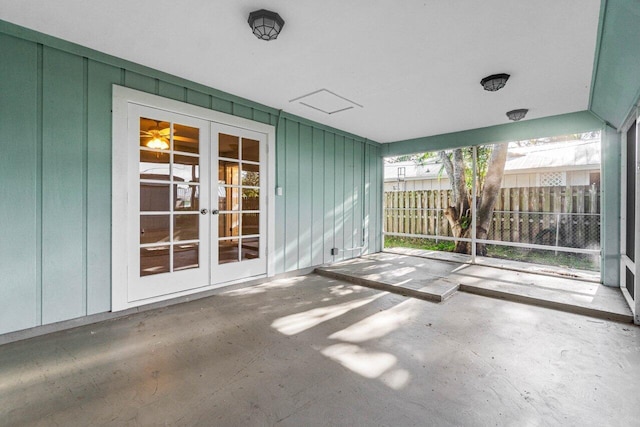 unfurnished sunroom featuring french doors