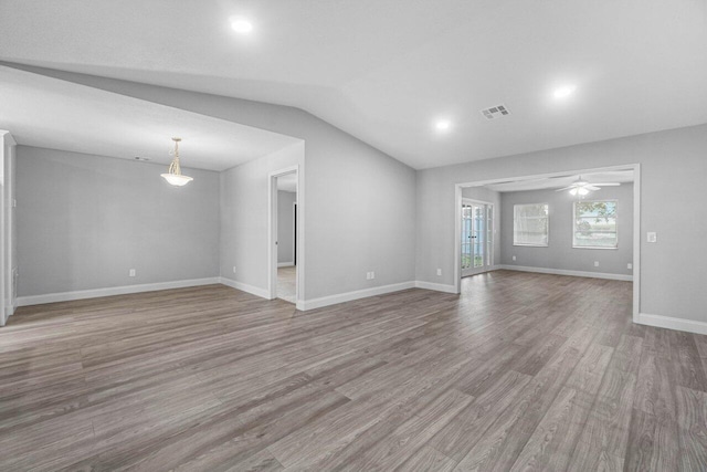 unfurnished living room with light hardwood / wood-style flooring, ceiling fan, and lofted ceiling