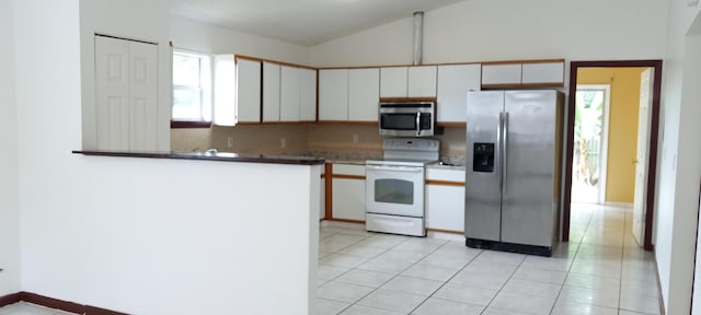 kitchen featuring kitchen peninsula, white cabinets, stainless steel appliances, and light tile patterned floors