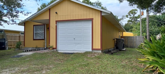 garage featuring a yard