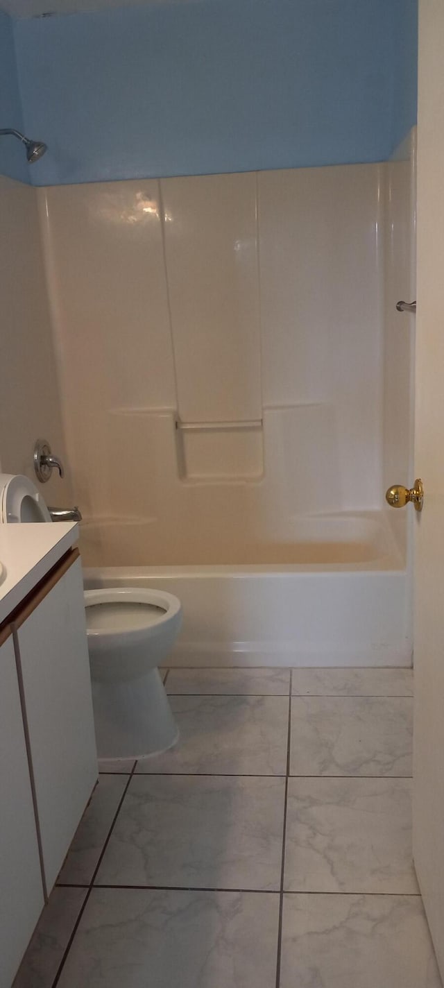 full bathroom with tile patterned flooring, vanity, toilet, and washtub / shower combination