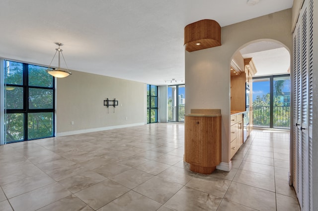 interior space with floor to ceiling windows and plenty of natural light