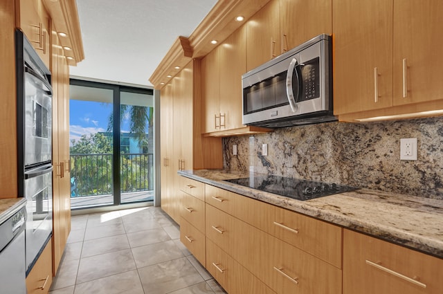 kitchen with light stone countertops, black electric stovetop, decorative backsplash, double oven, and light tile patterned floors