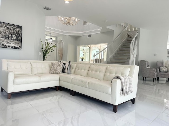 living room featuring a notable chandelier