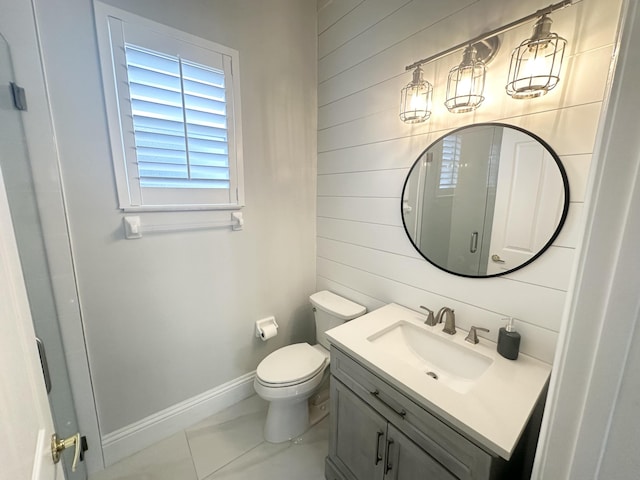 2727 Eleanor Way, Wellington, FL 33414 - bathroom featuring wooden walls, vanity, baseboards, and toilet